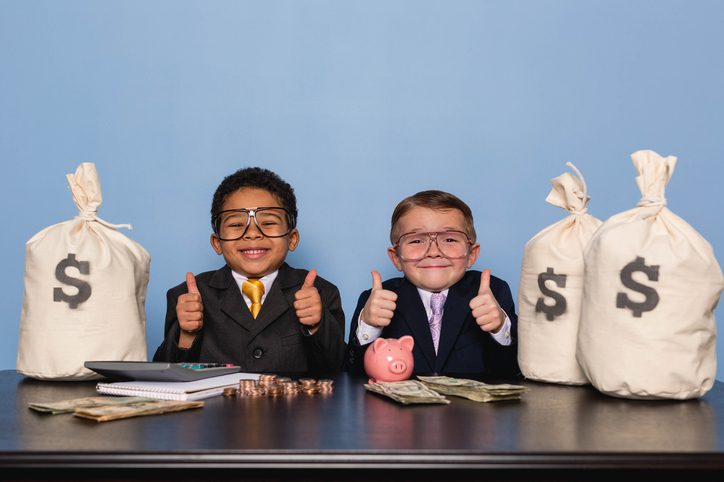 Public Adjusters Charge Is Worth The Money Two cute kids in business suits with money in front of them